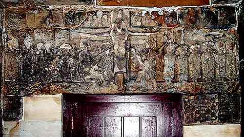 Carved Crucifixion Tableau on lintel, showing Christ, the Apostles and some soldiers
