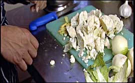 Ased prepares the cauliflower