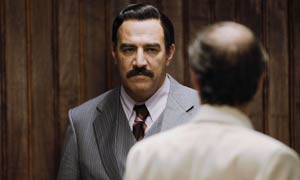Igal Naor plays Saddam Hussein