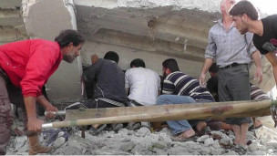 Nhà cửa bị tàn phá trong chiến sự ở Syria