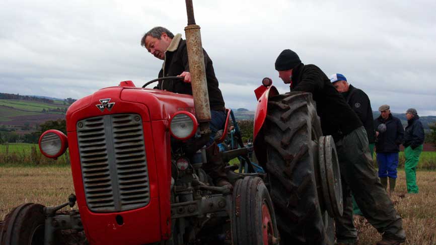 Euan McIlwraith and Mark look ahead to the Scottish Ploughing Championships. Euan is seen here trying his hand at ploughing under the watchful eye of tractor owner David Wood.