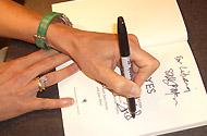 Joan Allen signs a copy of Yes