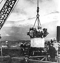 Men being lifted to the workface in a skip