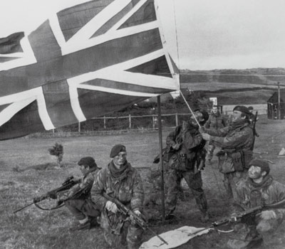 The flag is hoisted by the 40 Commando, Royal Marine at Port Howard