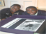 Tottenham Hotspurs Captain, Ledley King and David Lammy MP looking at Spurs Opus