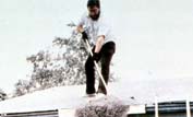 A man sweeps ash from his roof photo: USGS