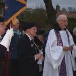 14.11.2004 St Begh’s RC Church, Whitehaven Cumbria. (Left to right): George Dunn (Standard Bearer), Billy Pye, Dom Luke Wareing OSB.   On the afternoon of Remembrance Sunday 2004, a short ceremony was held at St Begh’s to remember the victims of the World Wars. [Photograph by Joseph Ritson]