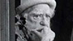Augustus John looks through an open window at the production crew during filming of Face To Face