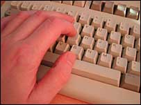 hand on computer