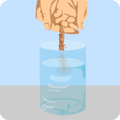 Add a handful of soil to a glass jar.