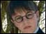 A boy dressed up in a Hogwart's uniform