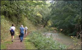 Jo walking along the canal