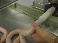 sausage coming out of machine