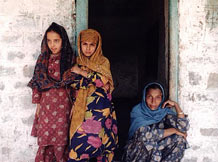 Indian family in Kashmir Family of Indian women in traditional clothing standing in a doorway