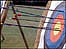 An archery target with arrows