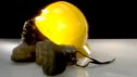 A hard hat and a pair of construction site boots
