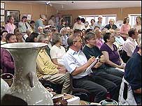 The packed auction room