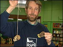 Pic: RSPB man David North with his bird feeder