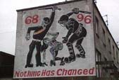 Image of a mural in Derry depicting two RUC officers beating a woman