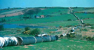 Farrans stringing pipes across the countryside