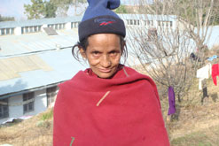 A widow who is around 40 years of age. She has been suffering from leprosy which has affected her eyesight