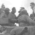 The first American tank on the Akerstraat, Treebeek on 17 Sept. 1944, Brother jaap is waving. Seen here with our friend Adje Paulen. The first American tank on the Akerstraat, Treebeek on 17 Sept. 1944, Brother jaap is waving. Seen here with our friend Adje Paulen.