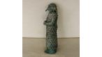 A bronze Assyrian statue of a priest