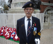 mid shot of man in front of poppies