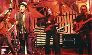 Ian Dury on stage with The Blockheads