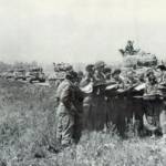 Tank Commanders of the 1st Polish Armoured Division, receive battle orders Falaise, 17th August 1944.  Mietek Herman fourth from left.