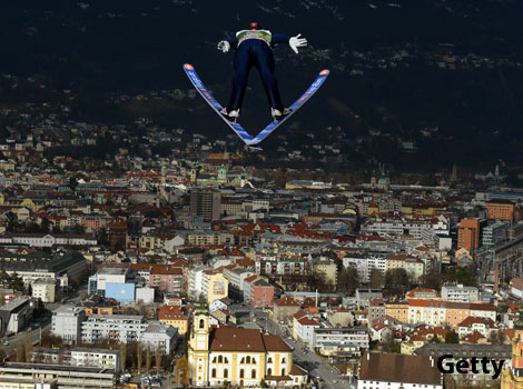 A man taking part in a ski jumping competition