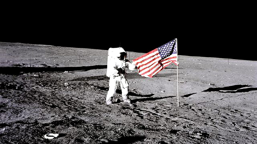 Charles Conrad Unfurls Flag