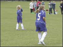Girls playing football