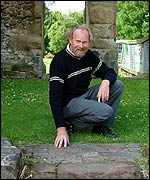 John Hemingway looks at the patch of tiles on the ground