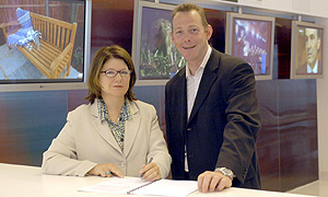 Jana Bennett, BBC Director of Television, and John McVay, Chief Executive of Pact, sign the Terms of Trade