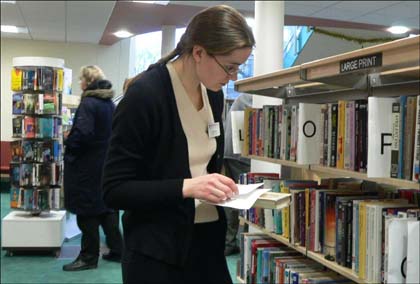 A staff member browses at the library